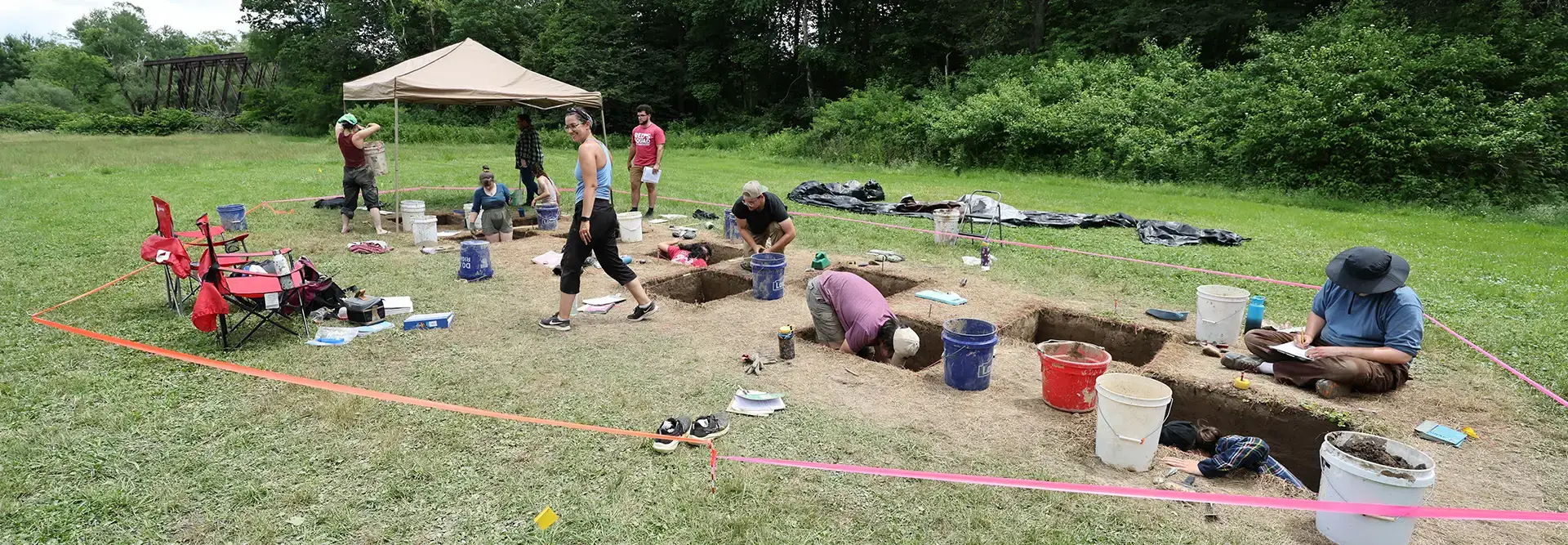 Archaeology student digs for artifacts