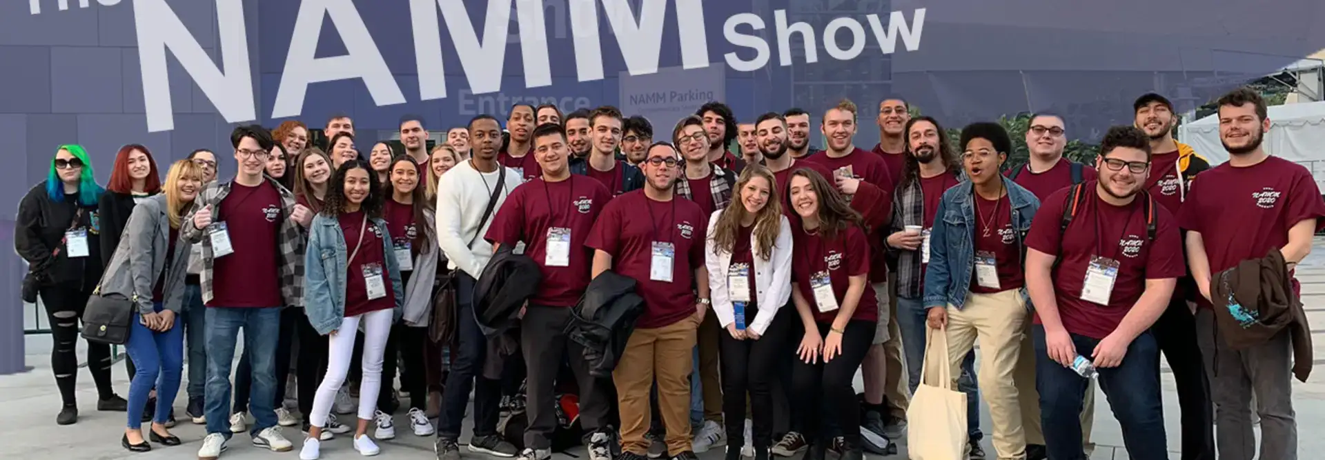 Students in front of NAMM Show sign