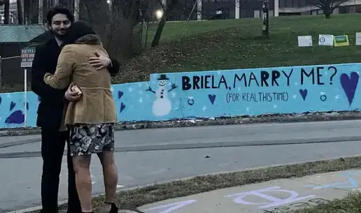 Alumnus Uses Oneonta Wall to Pop the Question