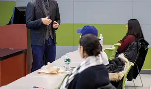 Scott Saltzman speaks to a fashion class