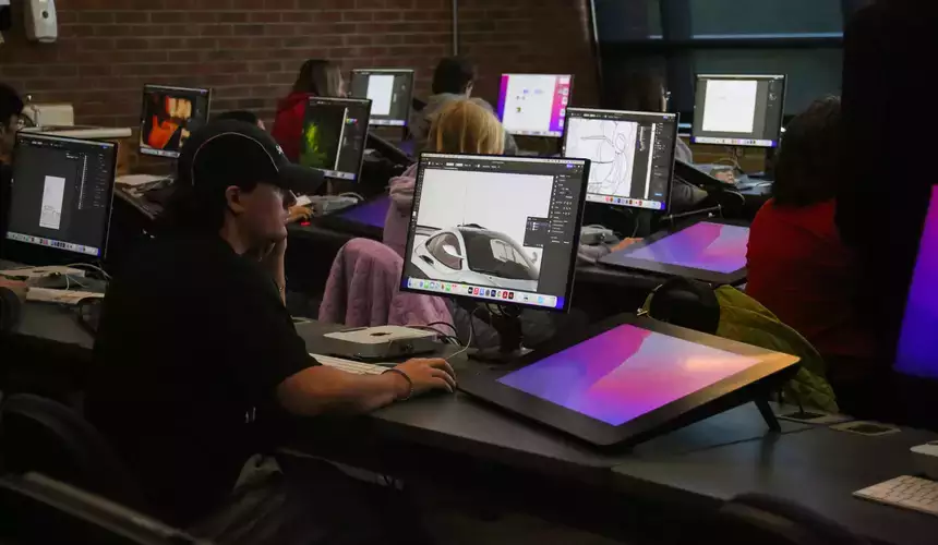 Students utilizing digital tools as part of their graphics class.
