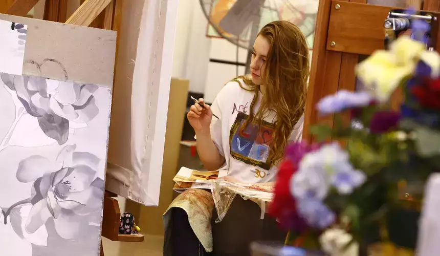 Students in a class taught by Professor Yolanda Sharpe work on the base layers of their oil paintings.