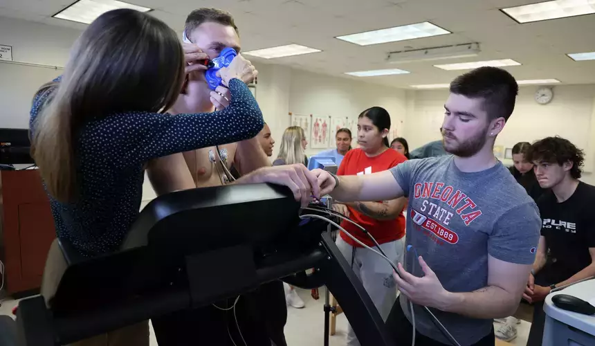Prepping a subject in the Exercise Testing and Prescription Lab