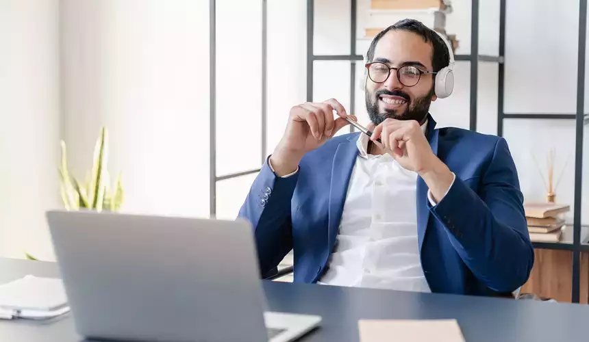 Business manager conducting an online call over a laptop