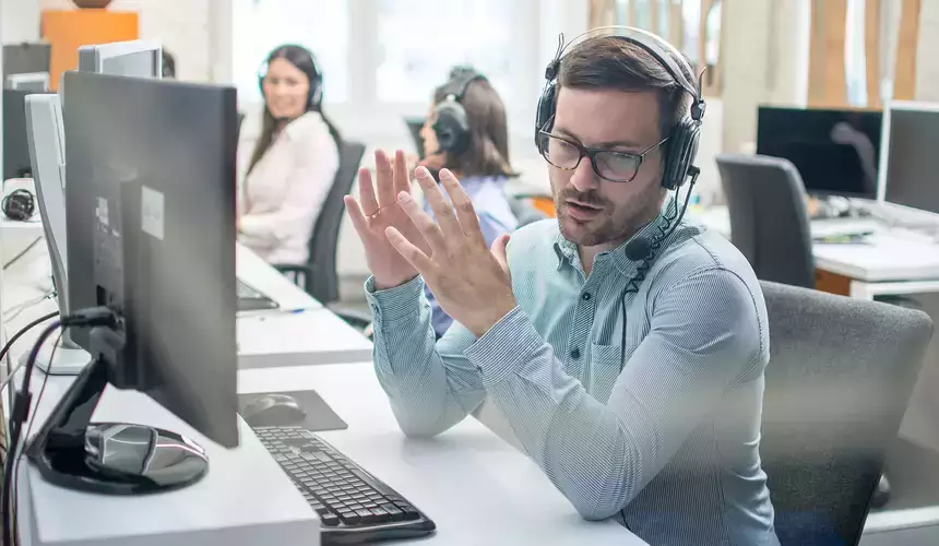 IT Customer support representative taking a call