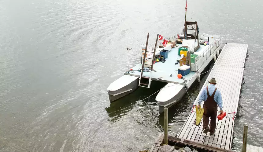 Preparing for a SCUBA dive on Otsego Lake at the Biological Field Station near Cooperstown