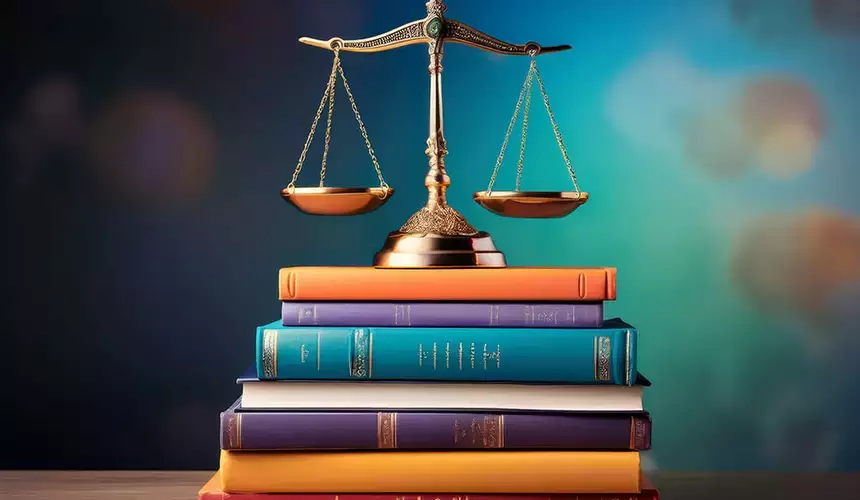 Scales of justice placed on a stack of books