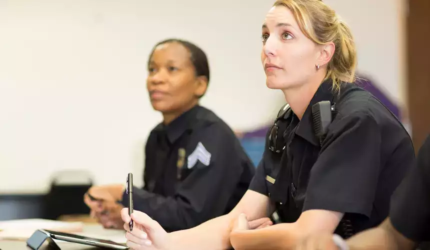 Students listen intently during a law enforcement academy class