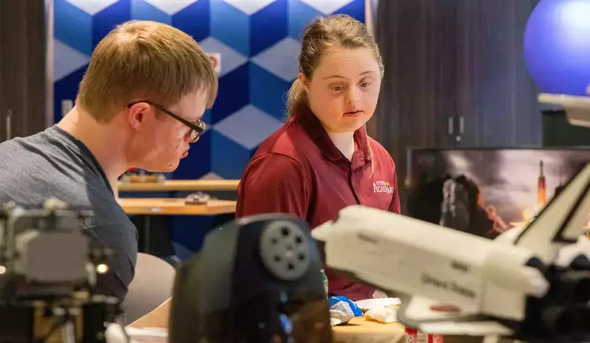 Students from the Pathfinder Village take part in learning activities at the Science Discovery Center.