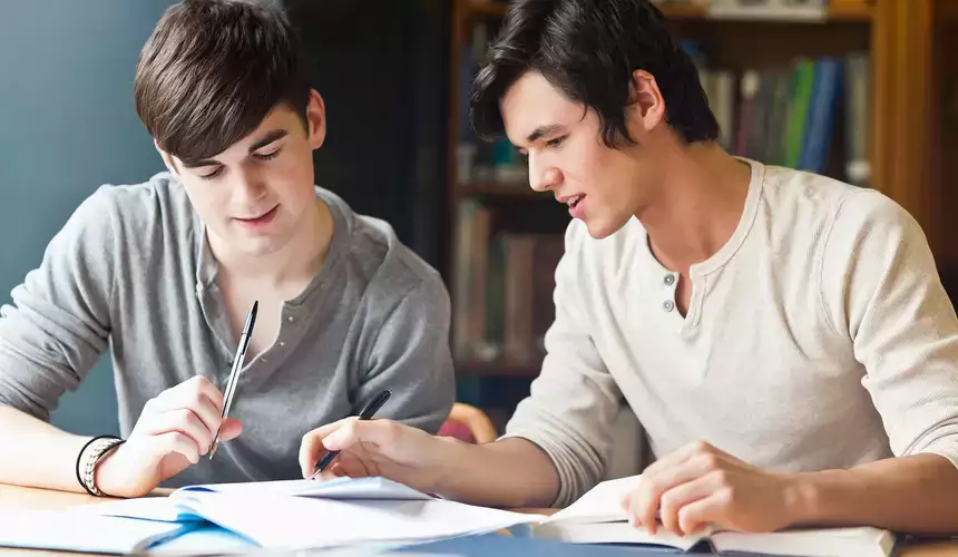 Individuals review material during a tutoring leadership course