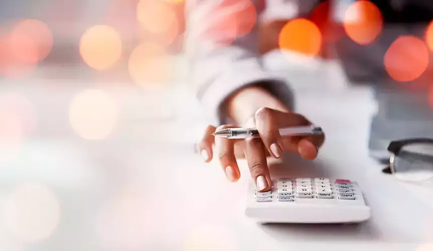 Calculator in use on a desk