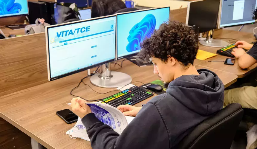 A student review information in the Volunteer Income Tax Assistance course