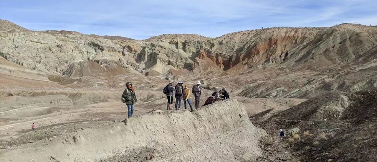 Geology students in a desert.