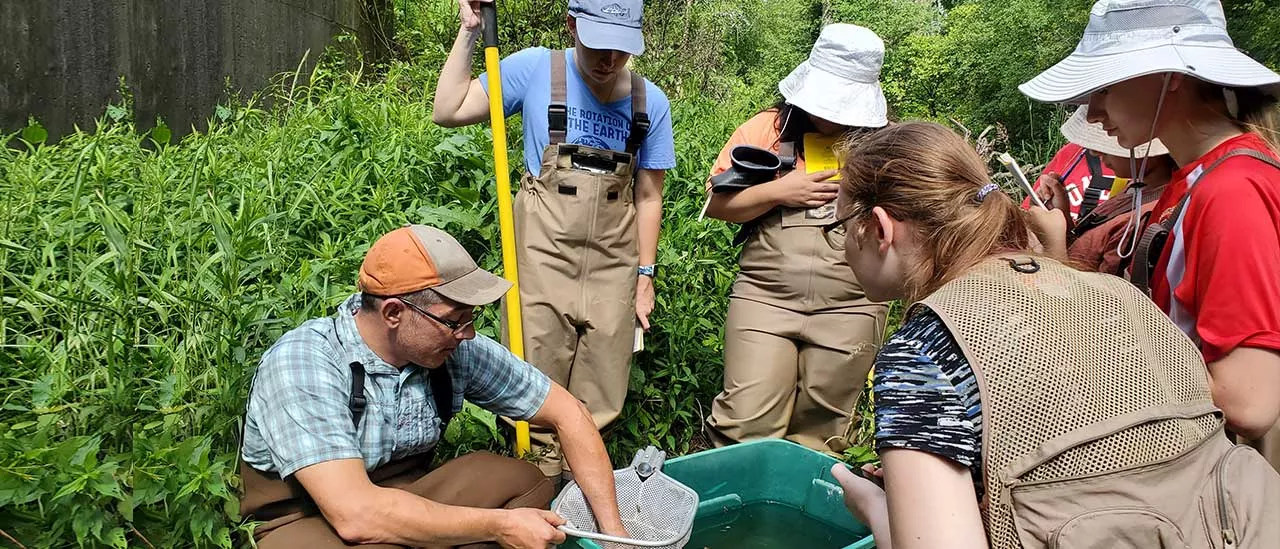 Students examining specimens found during Stream Camp.