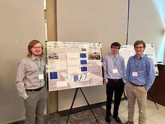 Physics students and their poster