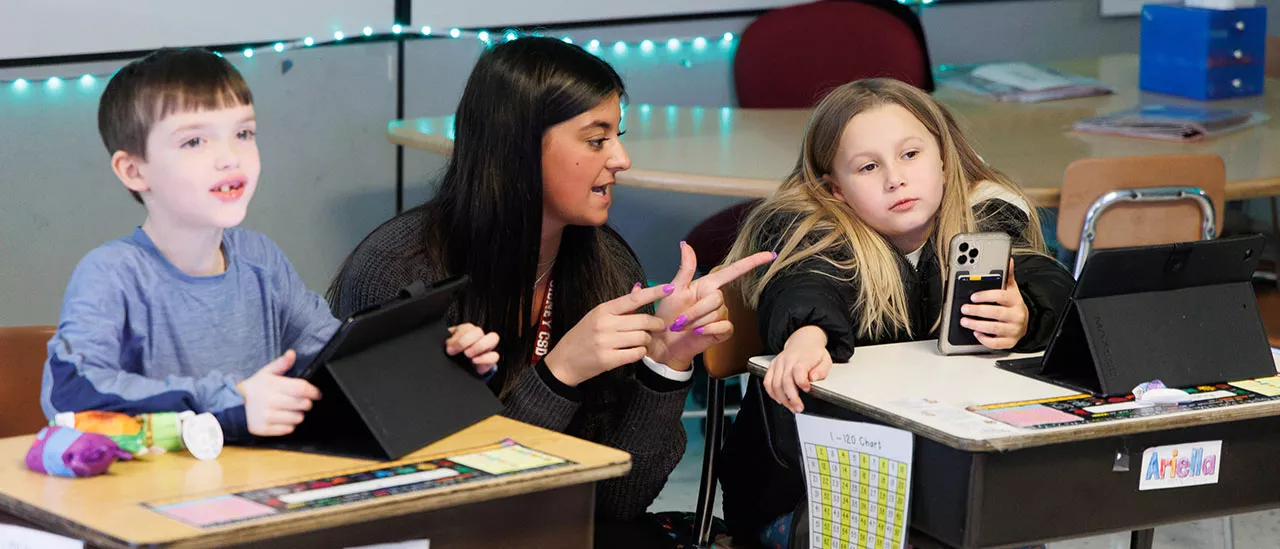 Elementary Education student teaching using tablets.