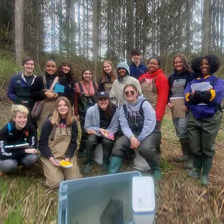 courtney evens with Biology class in the field