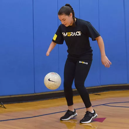Alexia Michitti playing with a soccer ball