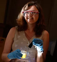 Jacqueline Bennett working in a lab with safety gear