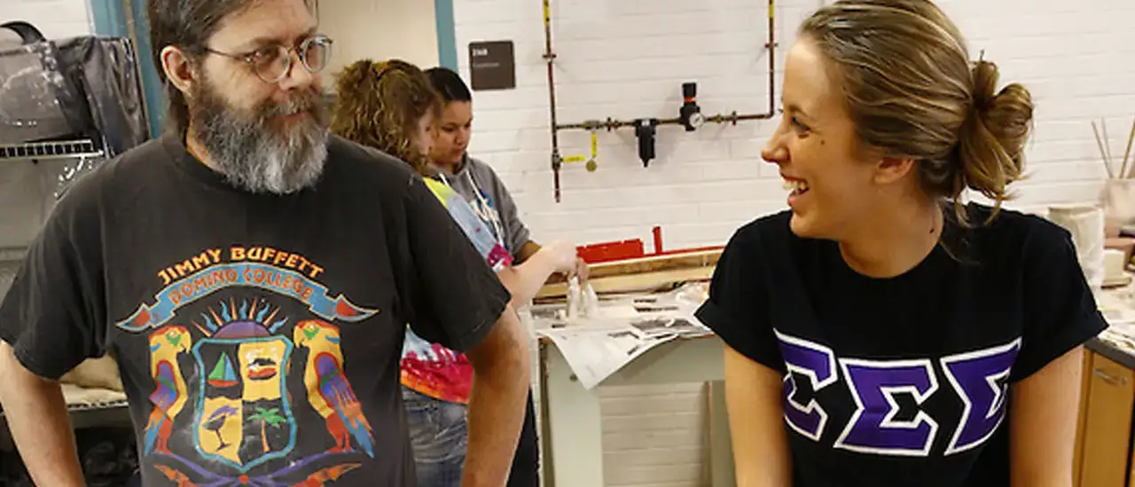 Students in a ceramics sculpture class at SUNY Oneonta, taught by potter and lecturer Chris Pettingill, work on making clay sculptures. Student names on file.