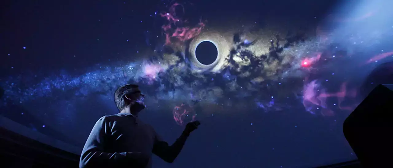 In the Planetarium at SUNY Oneonta, assistant professor of physics & astronomy Josh Nollenberg