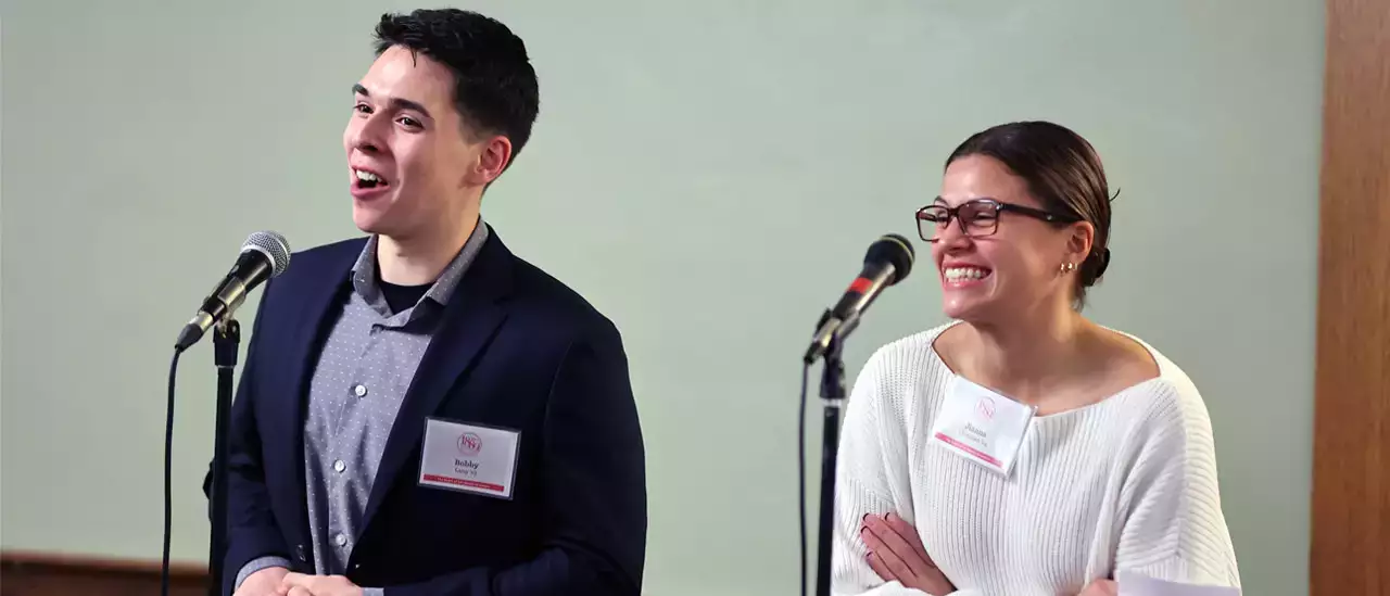 Students Bobby and Jianna receiving scholarships.