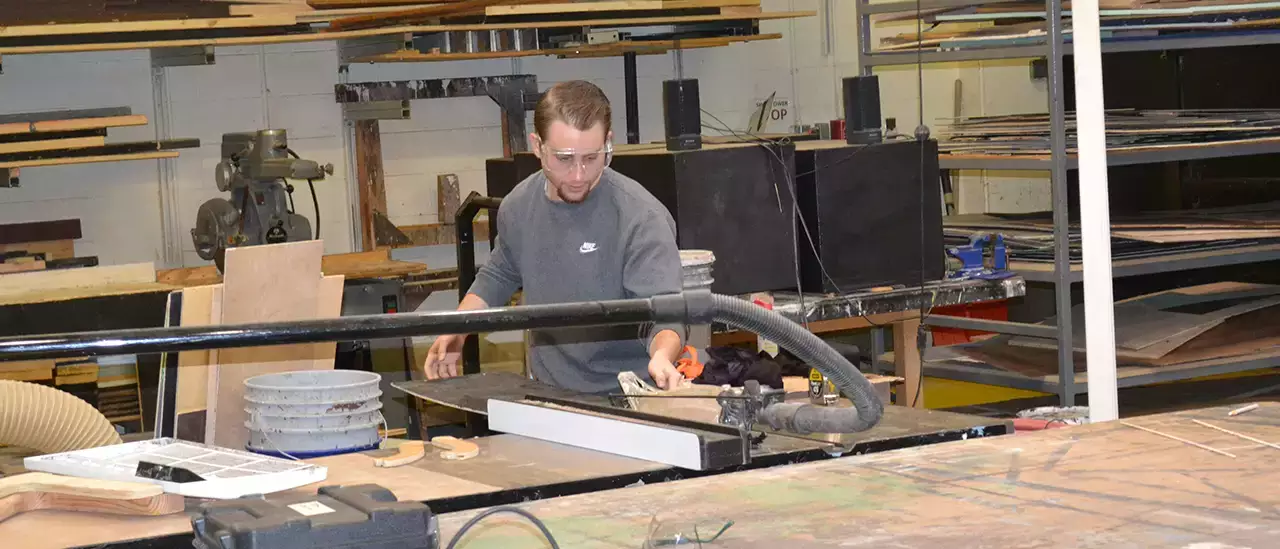 A student works in the scene shop at SUNY Oneonta