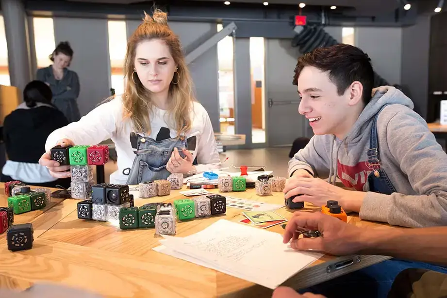 Students manipulate blocks in an activity in the Science Discovery Center