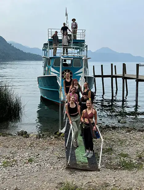 students exiting a boat ramp