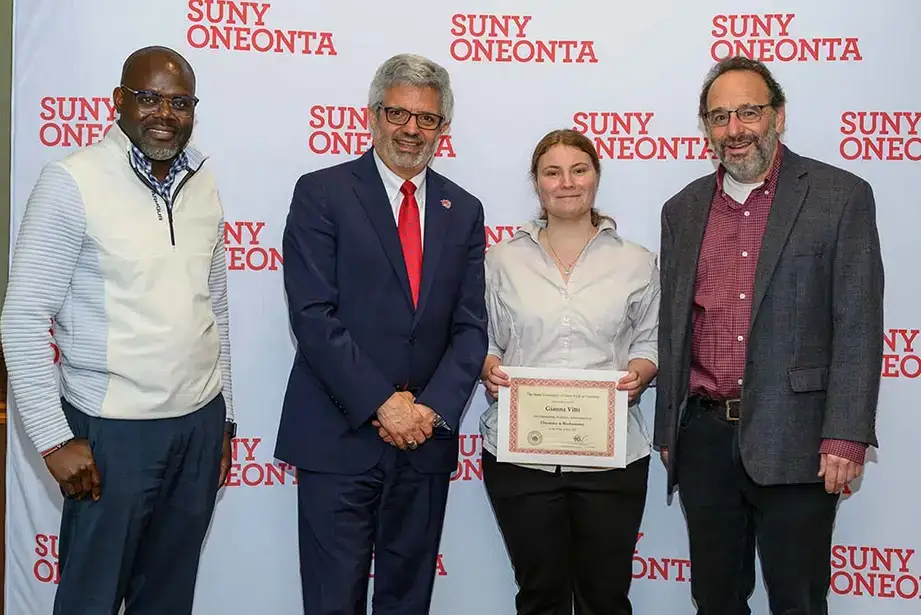 Dr. Maurice Odago, President Alberto Cardelle, Gianna Vitti, and Dr. William Vining at the 2025 Academic Achievement awards ceremony
