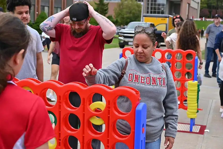 Attendees play a huge game of Connect Four during Family Weekend