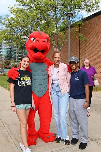 Red poses with a few admirers during Family Weekend
