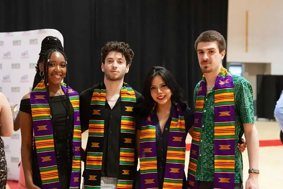 Students posing during Kente Graduation 2025