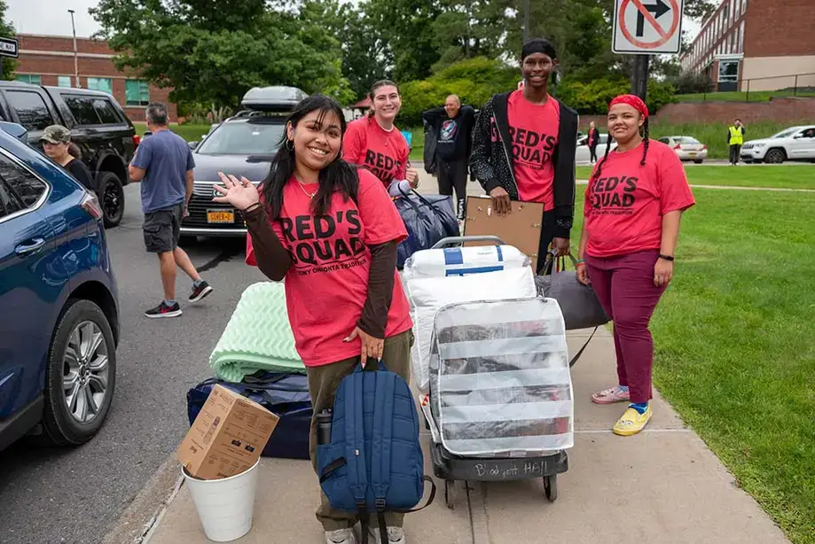 Carts, bags, and boxes being moved during move-in