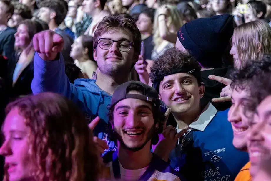 Audience members smile for the camera during the Oh-Fest 2025 concert.