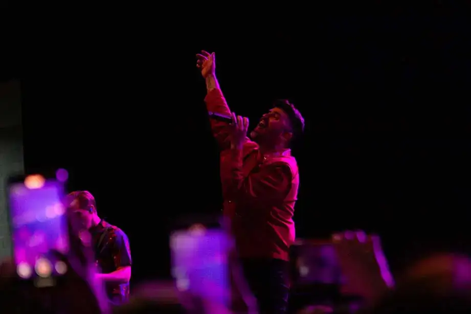 Singer for Neon Trees performing during Oh-Fest 2025.