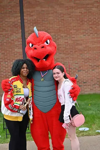 SUNY Oneonta Red poses with students on the quad during 2025 Oh-Fest Carnival