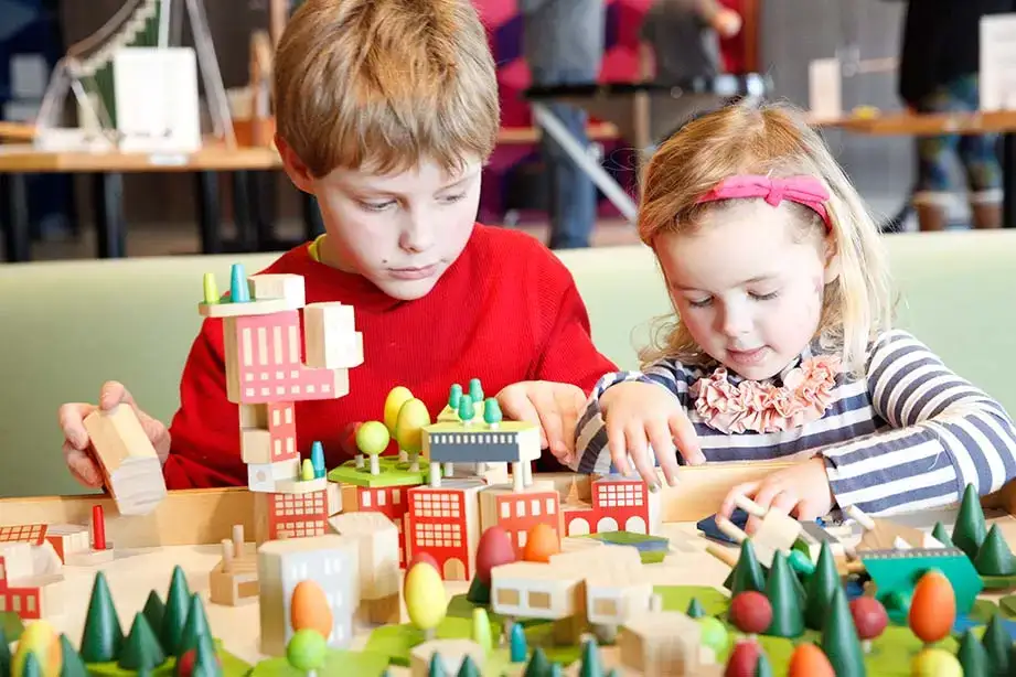 Children play with blocks in the Science Discovery Center.