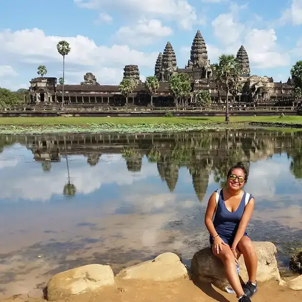 Angie Mendez poses with the Angkor Wat temples in Cambodia.