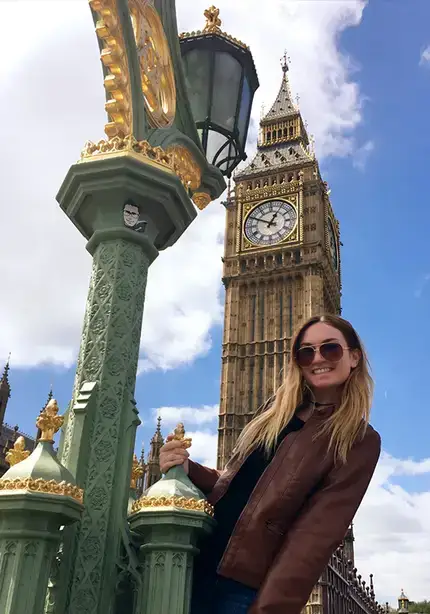 Kathryn Irizarry poses with Big Ben clock in London, England.