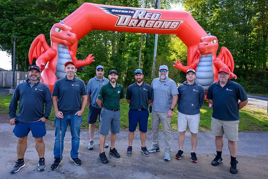 A group of players pose in front of the Red Dragons during the RDO.