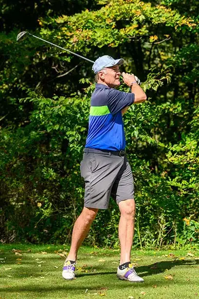 A player takes a swing at the Red Dragon Open.
