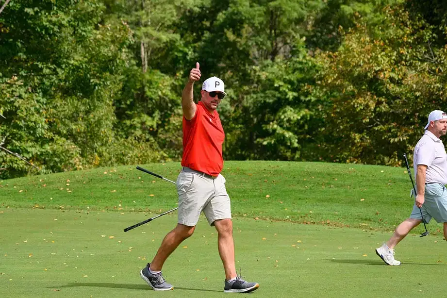 A contestant gives a big thumbs up during the Red Dragon Open.