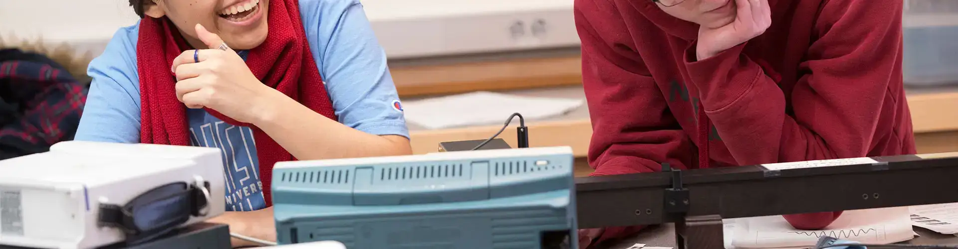 Students enjoying physics lab class