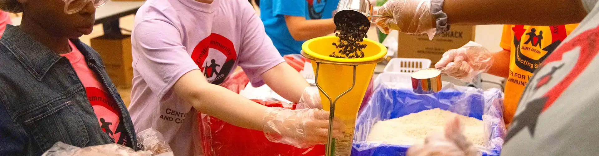 Students volunteer as part of 911 Service Day, creating meals for local food banks.