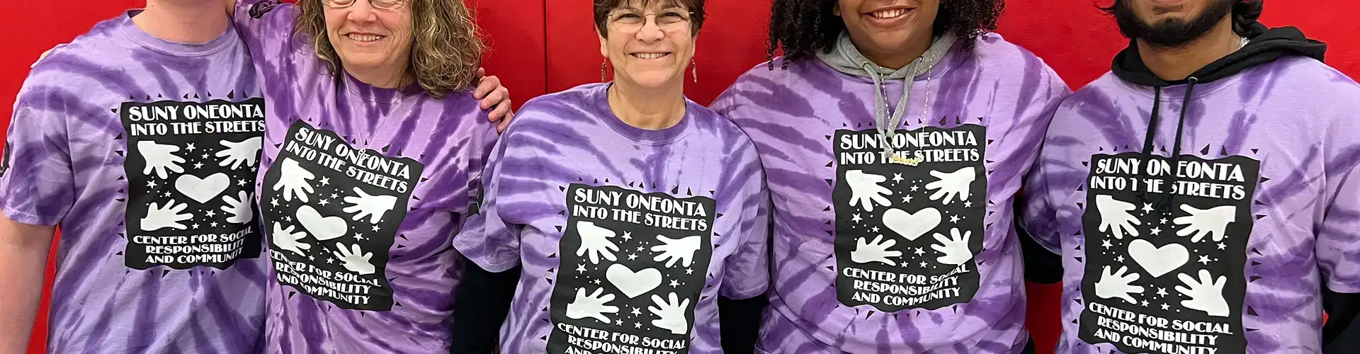 Volunteers working the SUNY Oneonta Into the Streets community event