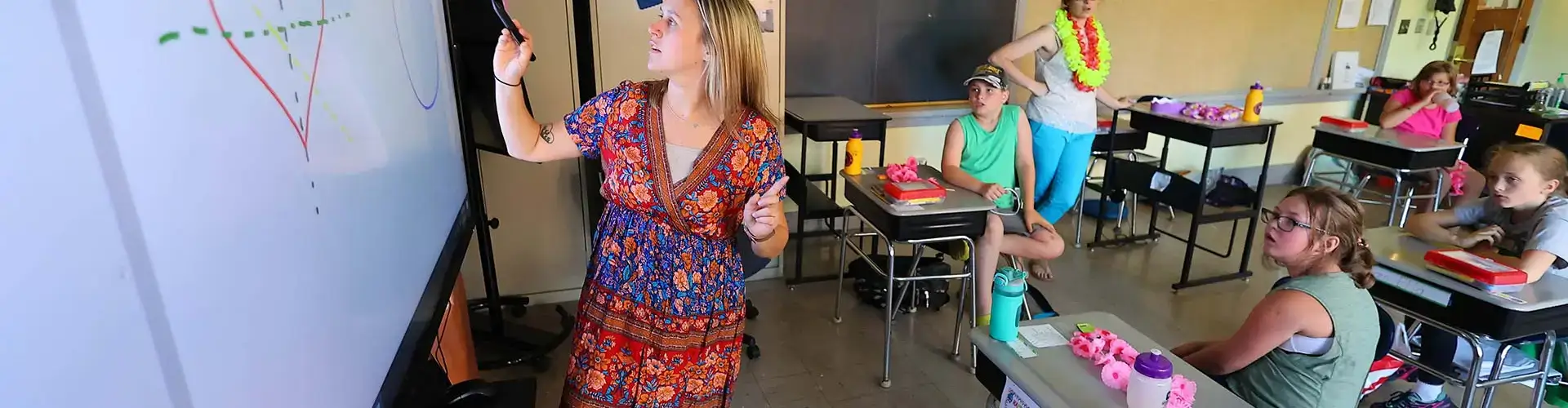 Young teach provides classroom instruction to elementary age students