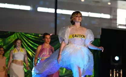Student models and designers participate in the annual fashion show.