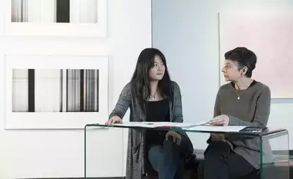 Kathy Spitzhoff, assistant professor of graphic design at SUNY Oneonta, advises studio art major Briela Tollisen.