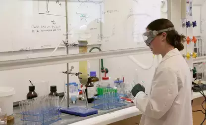 BioChem Major Jessica Shaw works in the lab during summer research.